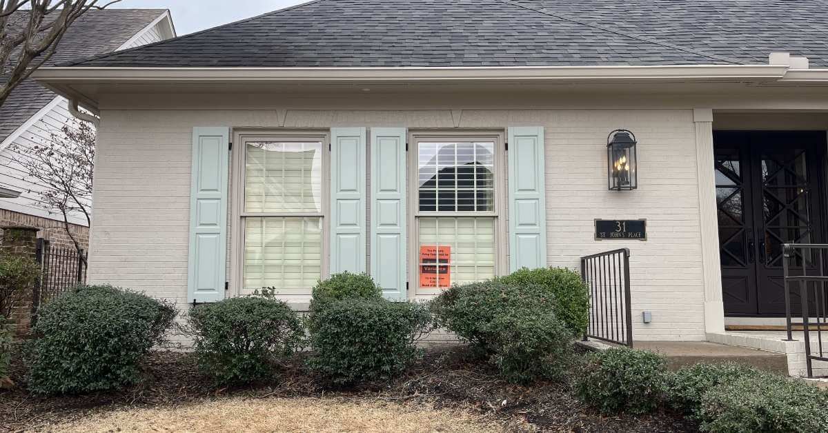 These custom raised panel shutters brought structure, symmetry, and elegance to the home’s façade.